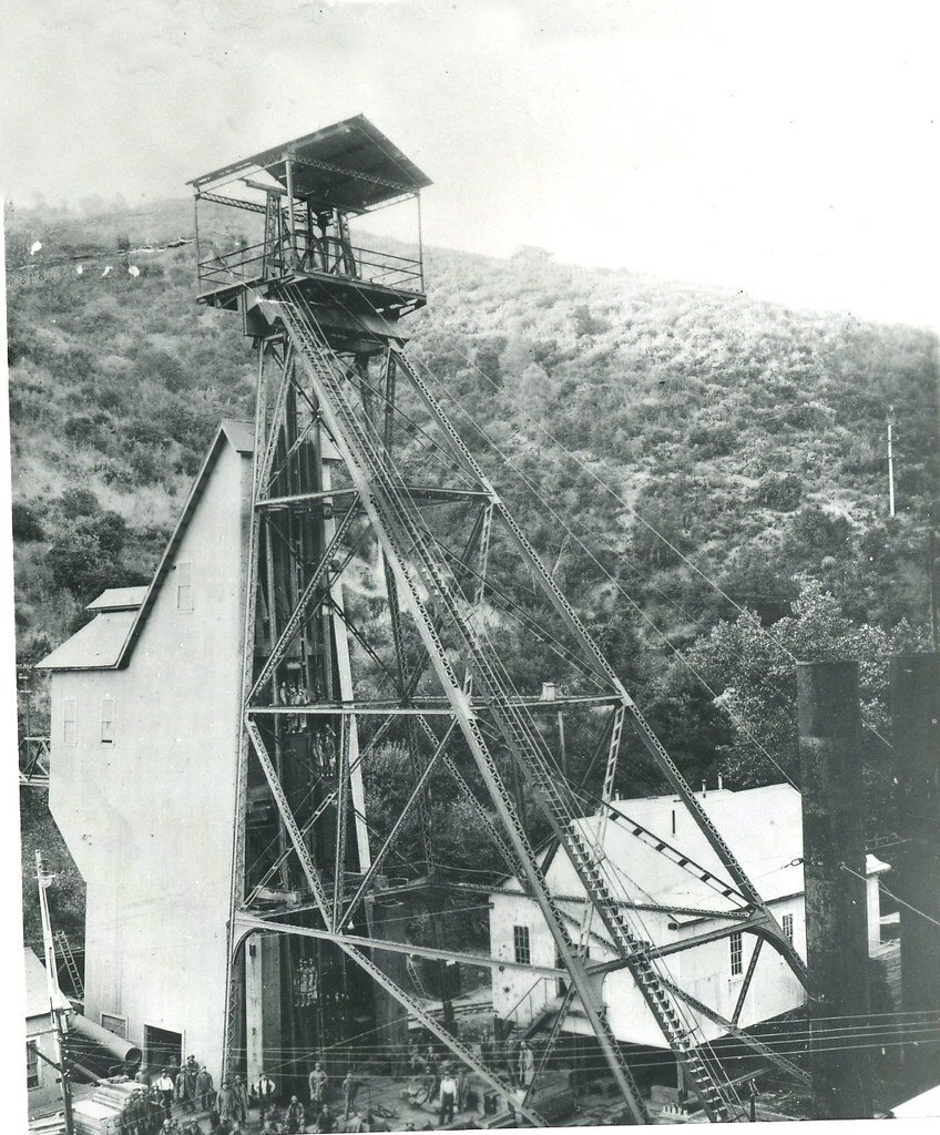 Gwin Mine: steel headframe and crew, with workers in the cages at top and bottom