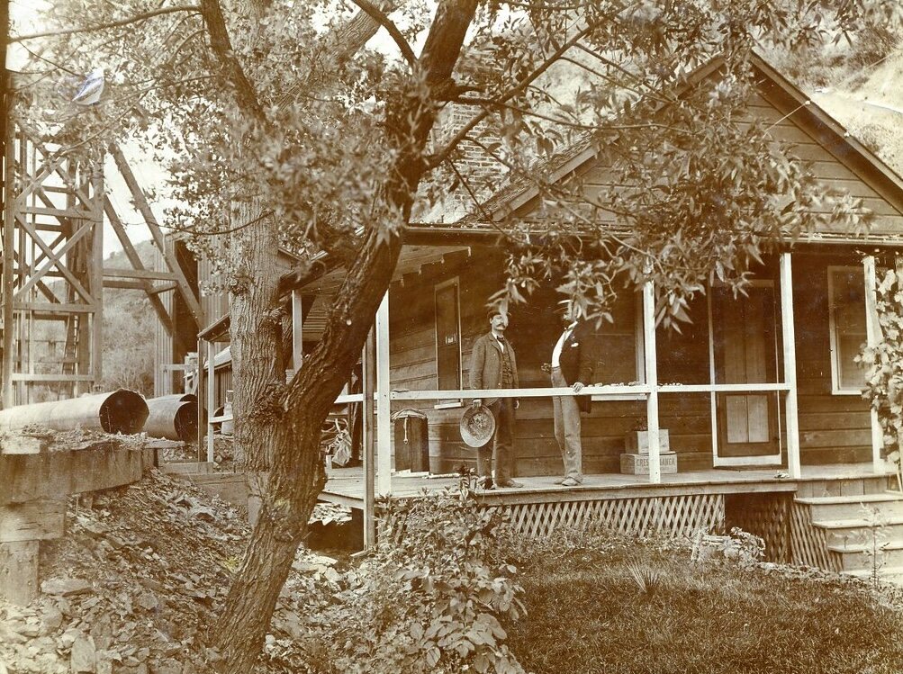 Frederick F. Thomas and David McClure on the porch of the Gwin Mine office, 1898